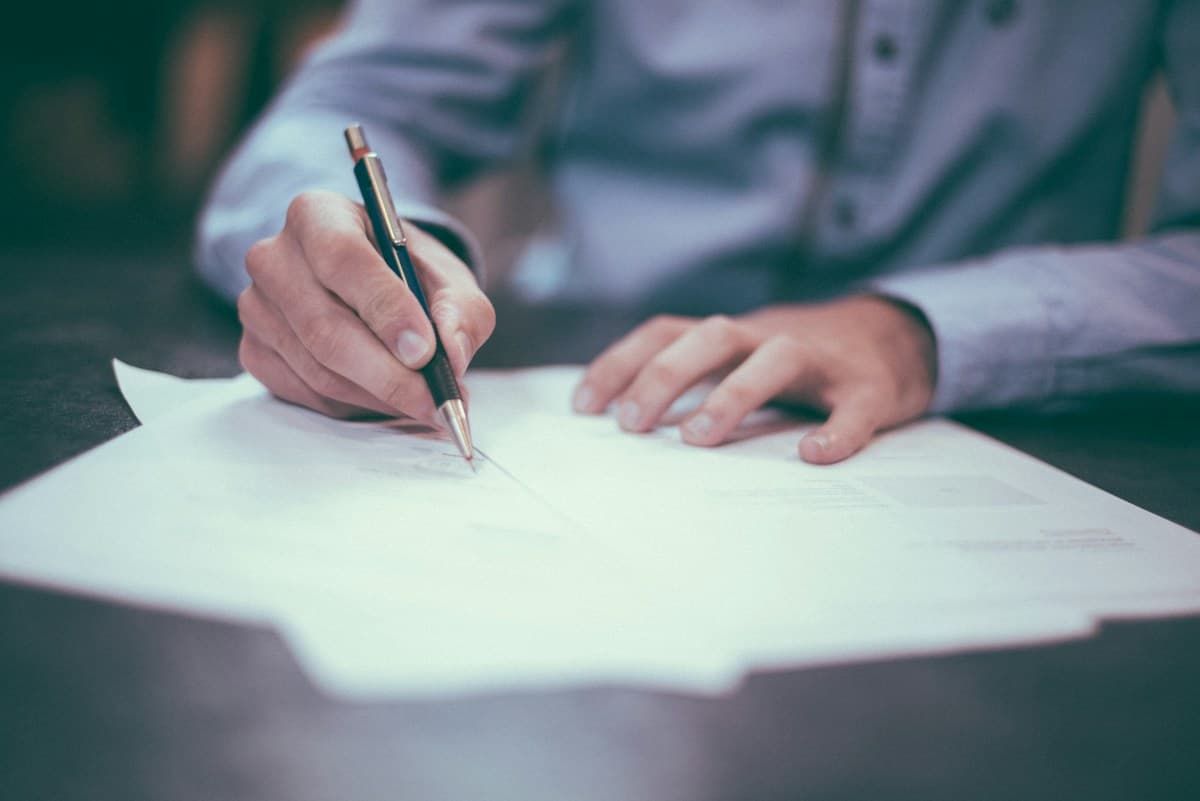 Careful attention to paperwork at a desk